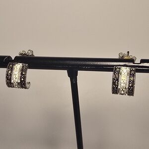 sterling silver J-hoop earrings featuring marcasite and pavé stones. 